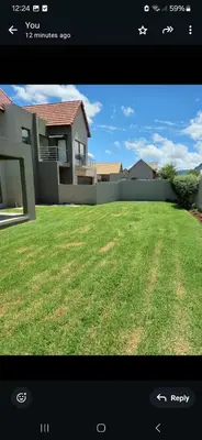 a picture of a house with a yard at Mountain view in Hartbeespoort
