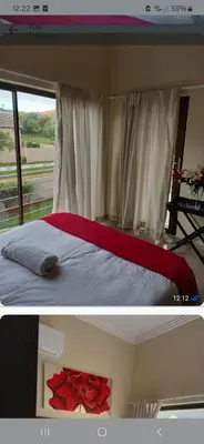 a bedroom with a bed with a red rose on it at Mountain view in Hartbeespoort