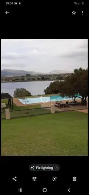 a screenshot of a screen with a picture of a park at Mountain view in Hartbeespoort