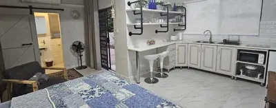 a kitchen with a sink and a counter top at Upstairs R-4 Self Catering Unit in White River