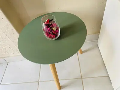 a green table with a bowl of flowers on it at Lesari Stay in Centurion