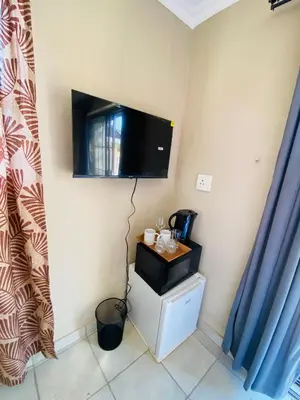 a room with a flat screen tv on the wall at Lesari Stay in Centurion