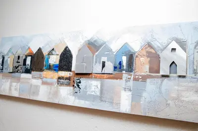 a painting of a group of houses on a wall at 85 Ehmke Guesthouse in Nelspruit