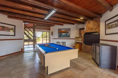 a room with a pool table and a tv at Zebula 4-bedroom, 12 sleeper - 63 in Warmbaths