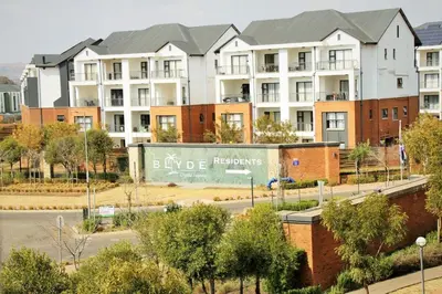a rendering of an apartment complex with buildings at Modern 2BR Retreat at The Blyde in Pretoria