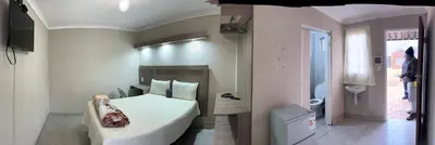 a bedroom with a white bed and a bathroom at Private 4 Double Room Guest Wing, Comfortable, Secure Parking, Wi-Fi, Ensuite Bath in Ermelo