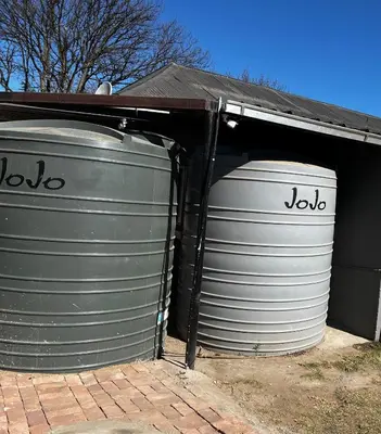 two grey barrels sitting inside of a garage at Private 4 Double Room Guest Wing, Comfortable, Secure Parking, Wi-Fi, Ensuite Bath in Ermelo