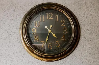 a clock is hanging on a wall at Cammys in Secunda