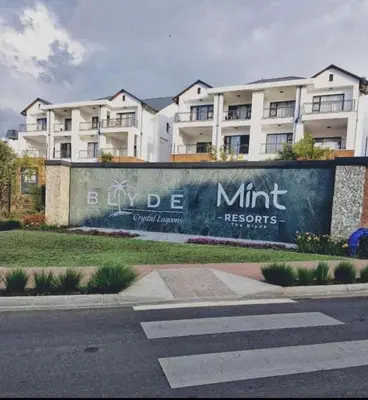 a sign on a wall in front of a building at WeAreTogetherLuxuryApartment in Pretoria
