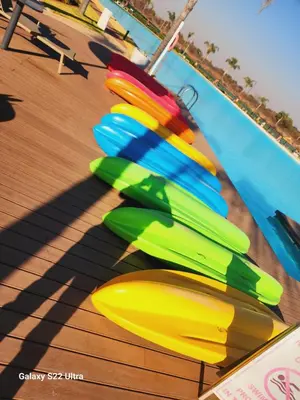 a group of colorful umbrellas sitting next to a pool at WeAreTogetherLuxuryApartment in Pretoria