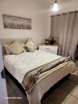 a bedroom with a bed with a bird on it at WeAreTogetherLuxuryApartment in Pretoria