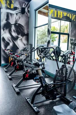a row of bikes parked in a gym at Walton Luxe Retreat in Midrand