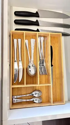 a wooden box filled with utensils on a shelf at Luxury Lakeview Retreat in Pretoria
