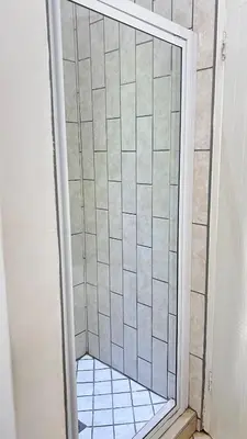 a shower with a glass door in a bathroom at Luxury Lakeview Retreat in Pretoria