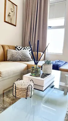 a living room with a glass table and a couch at Luxury Lakeview Retreat in Pretoria