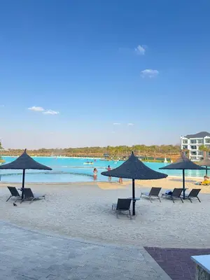 a group of chairs and umbrellas on a beach at Shezi Cozy Home at The Blyde in Pretoria