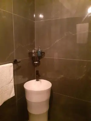a bathroom with a white toilet in a room at The Concept in Centurion