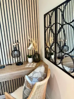 a balcony with a chair and a desk with a mirror at Modern Studio in Menlyn Maine in Pretoria