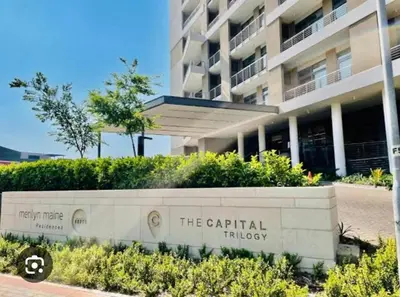 a sign in front of a building at Modern Studio in Menlyn Maine in Pretoria