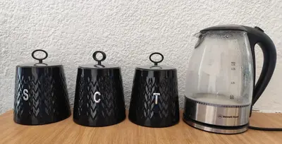 three black coffee makers on a table with a glass pitcher at Doringdraad Lodge Rooms Mufasa and Simba in Brendan Village