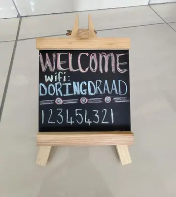 a sign that says welcome with a donuturger at Doringdraad Lodge Rooms Mufasa and Simba in Brendan Village