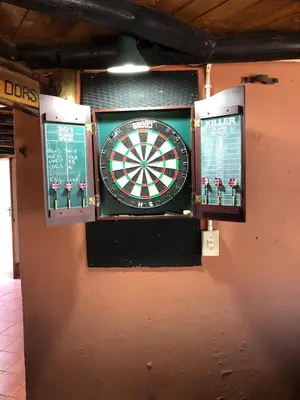 a dart board on the wall of a building at Doringdraad Lodge Nala and Zazu in Brendan Village