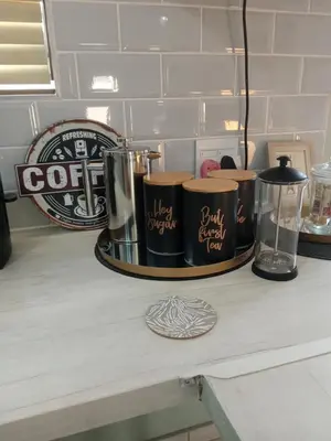 a counter with three coffee cups on a table at Wapadrand Modern Self-catering Apartment in Pretoria