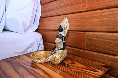 a figurine sitting on a table next to a bed at Morning Star Guest House in Kempton Park