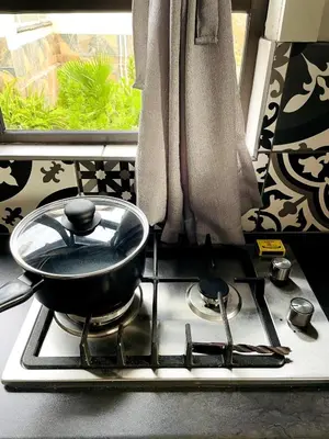 a frying pan sitting on top of a stove at The Shed - Capital Park in Pretoria