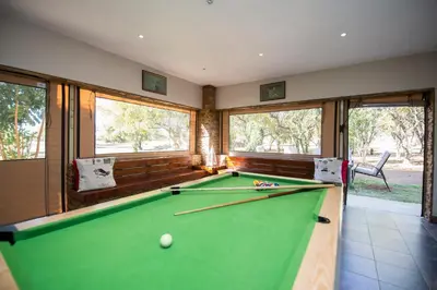 a snooker room with a pool table at Foreva Wild in Klipdrift