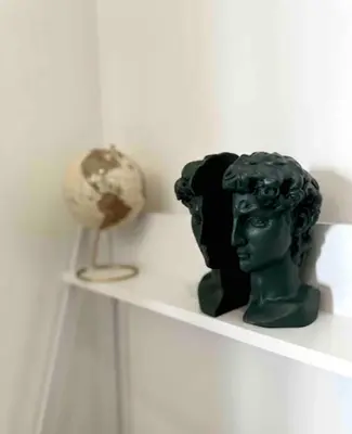 a shelf with a bust and a globe on it at A Private Room with a Private Entrance in Olifantsfontein