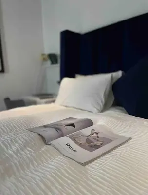 a picture of a woman on a bed at A Private Room with a Private Entrance in Olifantsfontein