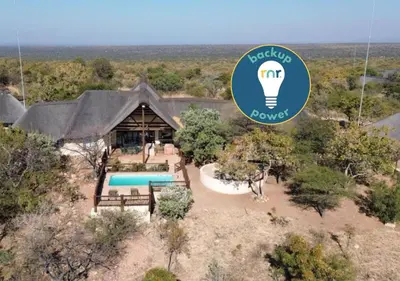 an overhead view of a house with a light bulb at 205 Zebula, 4 bedroom house in Warmbaths