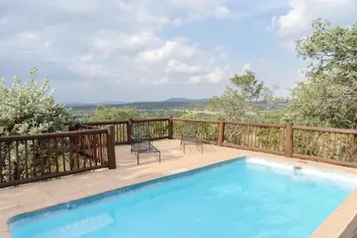 a swimming pool on the deck of a house at 205 Zebula, 4 bedroom house in Warmbaths