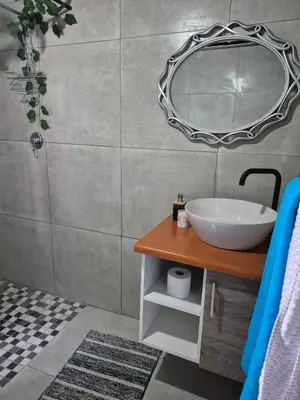 a bathroom with a sink and a mirror at Peace at 68 in Nelspruit