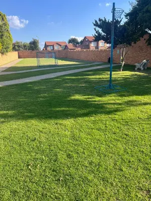 a blue pole in the middle of a grass field at The Reeds Private Garden House in Centurion