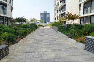 a walkway between buildings in a city at Luxury Escape at Ellipse 1-Bed, Kitchen, Wi-Fi & Free Parking in Midrand