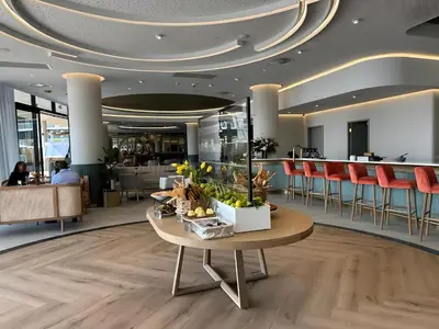 a lobby with a table with plants on it at Luxury Escape at Ellipse 1-Bed, Kitchen, Wi-Fi & Free Parking in Midrand