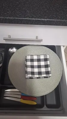 a hat and utensils are sitting in a drawer at Casa Maya in Pretoria