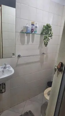 a bathroom with a sink and a toilet at Casa Maya in Pretoria