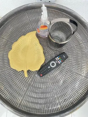a metal strainer with a remote control at Lakeside Studio Sleeps max 2 in Benoni