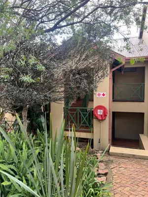 a building with a red box on the side of it at Apartment with stunning scenic views in Pretoria