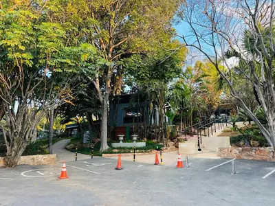 a parking lot with orange cones in front of trees at Apartment with stunning scenic views in Pretoria