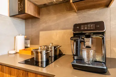 a coffee maker on a counter in a kitchen at Menlyn Luxury Studio KingBed XL Free Parking 137 in Pretoria
