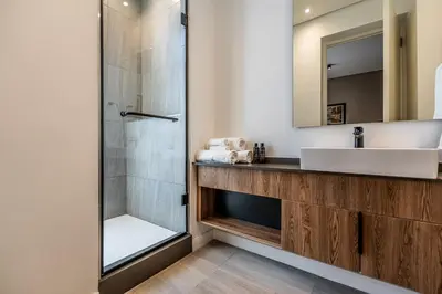 a bathroom with a sink and a shower at Menlyn Luxury Studio KingBed XL Free Parking 137 in Pretoria