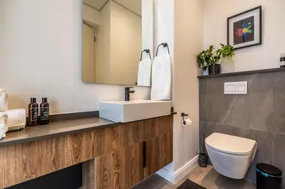 a bathroom with a sink and a toilet at Menlyn Luxury Studio KingBed XL Free Parking 137 in Pretoria
