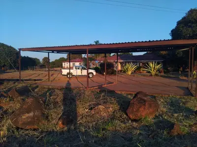 a truck parked under a building with a roof at Lutendo accommodation in Thohoyandou
