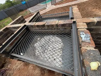 a metal grate on the side of a building at Glowti Event & Guest House in Centurion