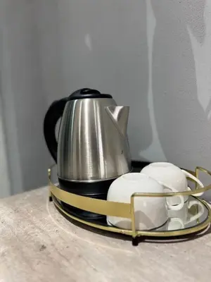 a tea kettle on a tray next to two mouses at Glowti Event & Guest House in Centurion