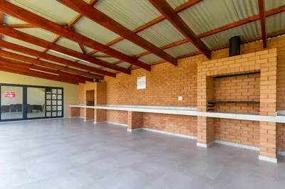 a large empty room with a brick wall at #AlimamaSpaces The Manson's Kyalami Woods in Midrand